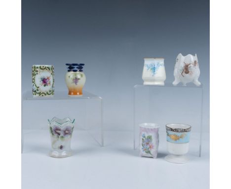 A lovely set of seven toothpick holders elegantly painted with vibrant flowers and lush greenery, featuring a mix of round an