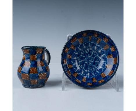 Beautiful blue and brown checkered pitcher and bowl set made of glazed pottery. Pitcher measures 3"L x 2.5"W x 3"H. Bowl meas