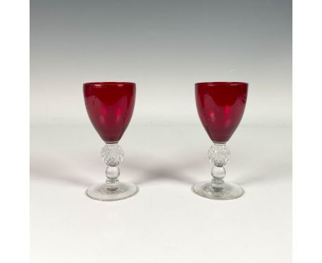 Ruby colored cordial glasses with bead style stems and intricate golf ball accents on the stems. Dimensions: 2.25"W x 4.75"HC