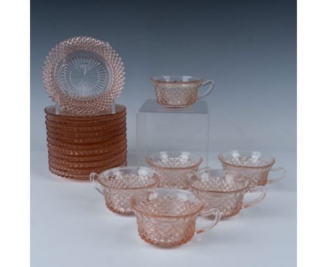 Splendid collection of diamond cut glassware that dons a beautiful clear pink color and consists of six teacups with six sauc