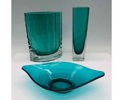 Art deco collection of translucent glassware that consists of a slender and square vase, an oval shaped ribbed vase, and a le