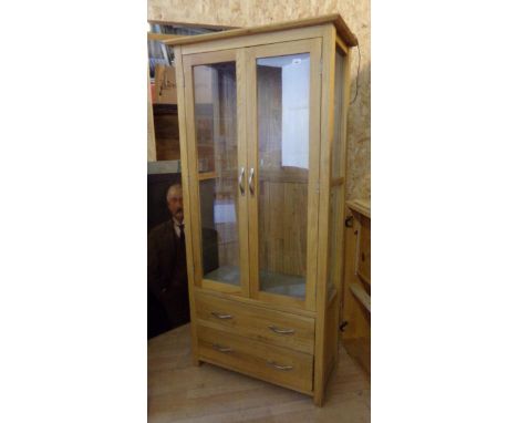Cotswold Collection light oak display cabinet, twin glazed doors enclosing a shelved interior over two long drawers, 180 high
