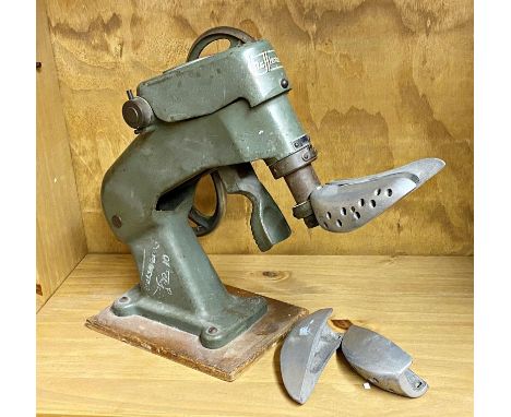 A vintage 20th Century German cast metal Rafflenbeul Euperdus mechanical cobblers shoe repair stretcher having a green enamel