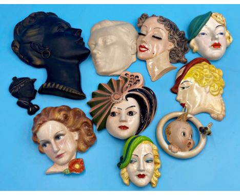 Collection of vintage pottery wall masks to include a Hummel baby with bee, Solian Ware King Edward, Crown Devon had painted 