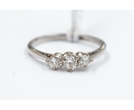 A platinum and diamond three-stone ring, size J½, total gross weight approx 2.4gms
