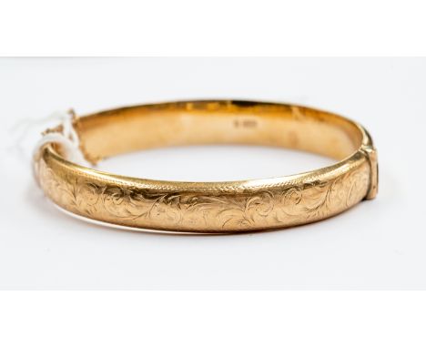 A 9ct yellow gold bangle, engraved leafage scrolls, sponsors mark, "B Ltd", approx 22 grams