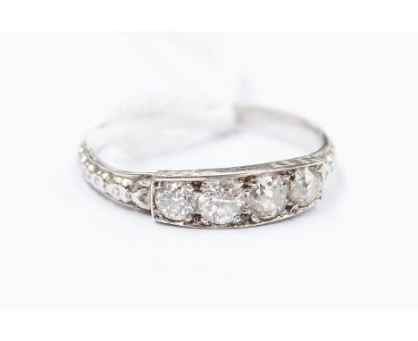 An Art Deco diamond set platinum ring, comprising four stones set to the top, size K, total gross weight approx 2.2gms 