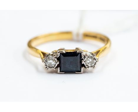 An 18ct gold diamond and square-cut sapphire ring, platinum settings, size O½, gross weight approx 3.1gms