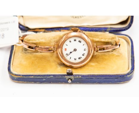 A 9ct rose gold 1930's ladies wristwatch on expander strap, white enamel dial, dial diameter approx 19mm, case diameter appro