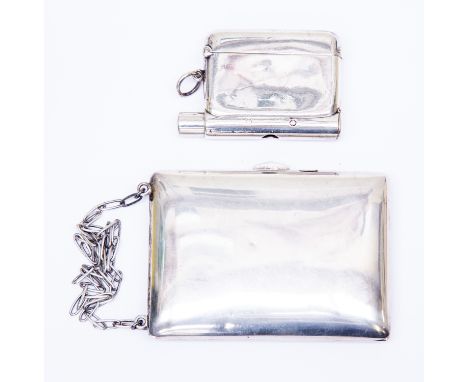 An early 20th Century possibly American plain silver vanity coin case, the interior with cigarette folder, two coin holders a