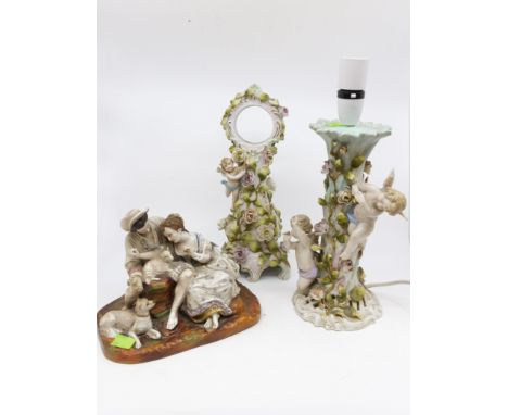 Porcelain Continental lamp with mantle clock and figure group, German