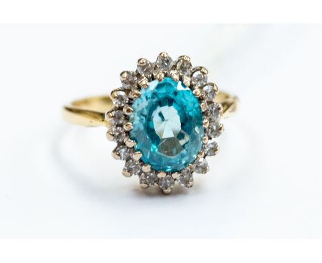 An 18ct gold blue zircon and diamond cluster ring, ring size I, total gross weight approx 4gms,  size 7mm x 6mm, 