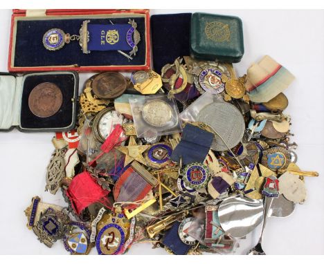 A large collection of enamel membership badges, medallions, etc. Some in silver.