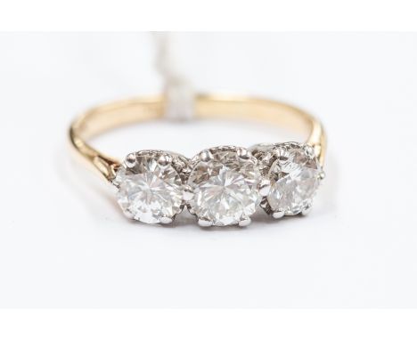 A diamond three-stone 18ct yellow gold ring, three round brilliant cut diamonds, total diamond weight of approx 1.60 carat, c