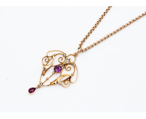 An Edwardian 9ct rose gold seed pearl and amethyst open work pendant, along with a rose gold belcher chain, total gross weigh