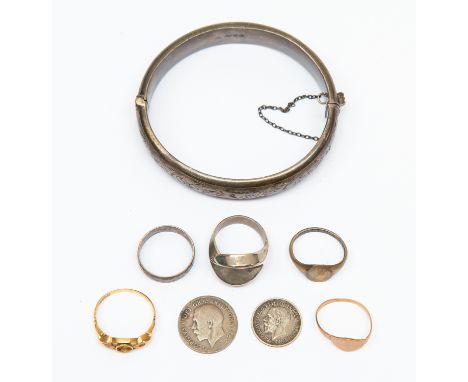 An 18ct gold ring, 1.9gms (af); a 9ct gold ring, 1.1gms; a silver bangle, Chester 1890, 19.9gms; three white metal rings and 