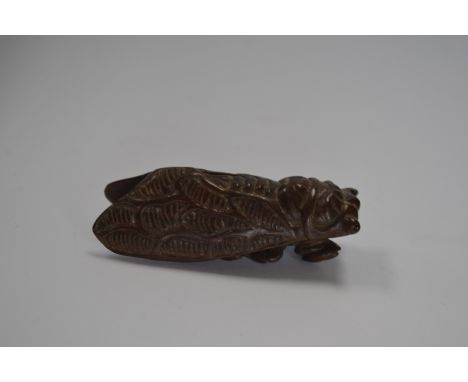 A cicada treen netsuke, signed 