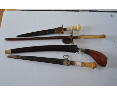 A collection of four knives consisting of: an Oriental knife with curved single edged 21cm blade. Carved wooden grip. 30cm ov