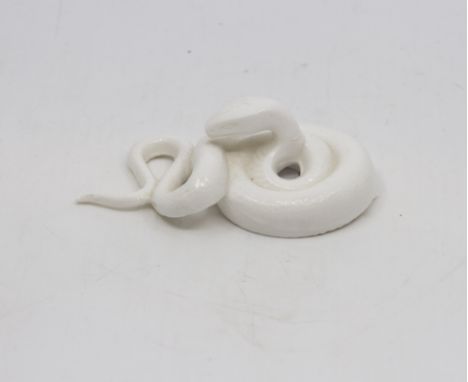 A unmarked Royal Worcester netsuke modelled as a coiled snake, made by the factory exclusively for Mr Henry Sandon circa 1975