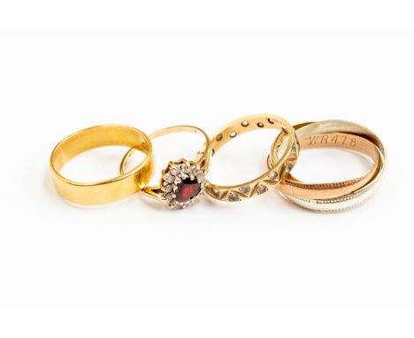 A 22ct wedding band, size N, approx 3.6gms; 9ct and paste eternity ring, approx 1.5gms gross; 9ct tri-gold three band ring, a