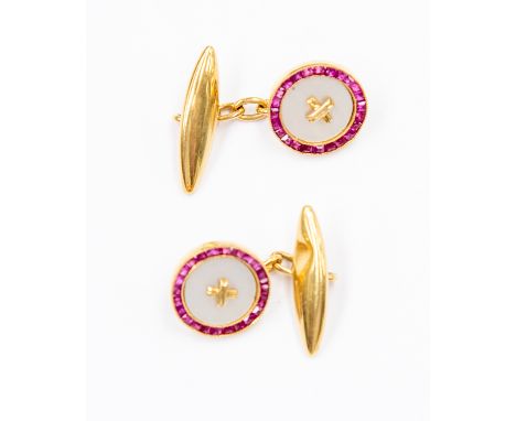 A pair of 18ct yellow gold chain cufflinks, circular fronts set with mother-of-pearl to centre, channel set square-cut rubies