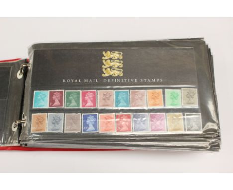 Red vinyl ring binder; Mint definitive value stamps