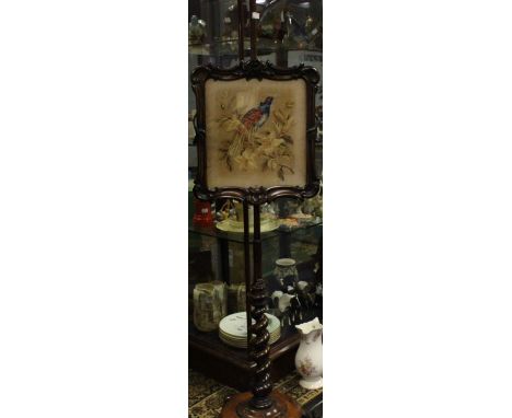 A Victorian Mahogany Tapestry firescreen, turned support.