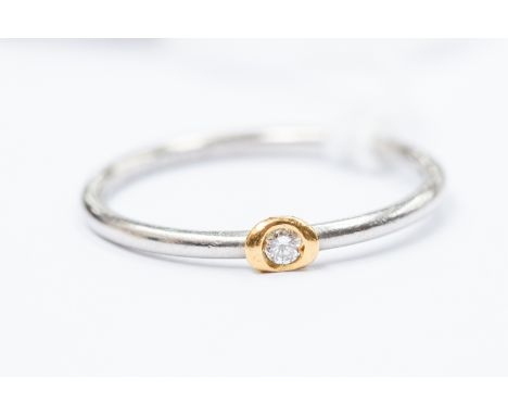 A platinum and diamond solitaire ring, yellow gold setting, shank stamped 0.03ct, size M, gross weight approx 2.1gms