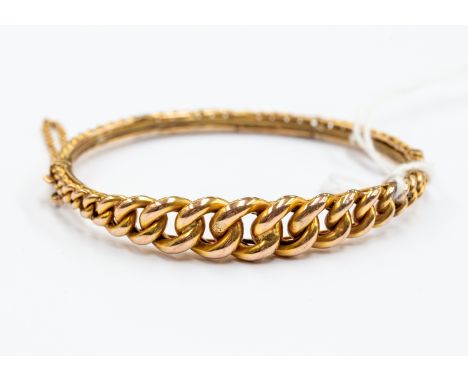 A 9ct curb link bangle, weight approx. 11gms.