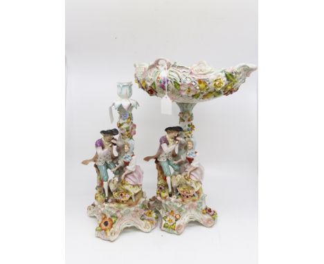 German porcelain comports with courting couple and a matching candle stick