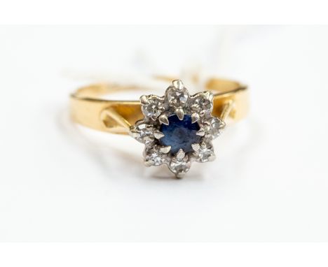 An 18ct gold, sapphire and diamond cluster ring,  with palladium settings, size N, gross weight approx 3.5gms