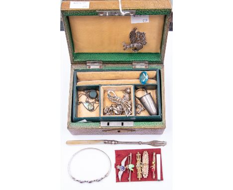 A small jewellery box of mixed Marquisite, silver rings, bracelet, silver charms, RAF sweetheart badge, silver pickle fork an