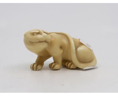 A Royal Worcester blush ivory netsuke modelled as a Tiger, 7.5cm long 