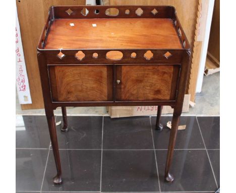A George III mahogany night commode circa 1770 with pierced gallery.