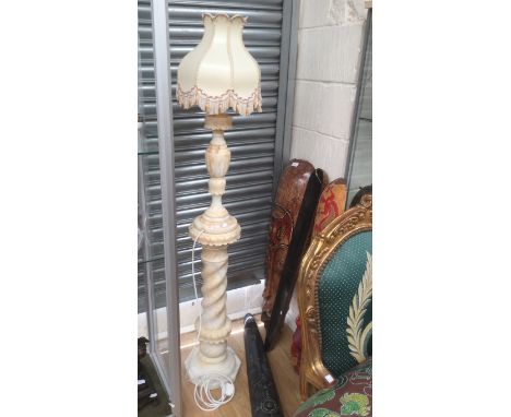 An alabaster lamp, standing on a matching alabaster base