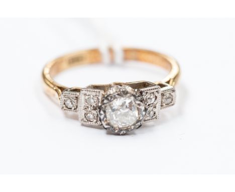 an 18ct gold and diamond solitaire ring, old-cut centre stone approx 0.2ct, flanked by diamonds to each shoulder, size K, gro