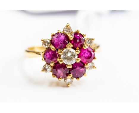 A ruby and diamond cluster ring claw set, diamond centre with ruby surround, 18ct gold, size N, total gross weight approx. 4g