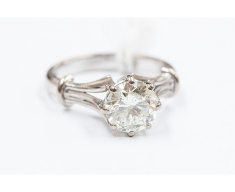 A solitaire diamond 18ct white gold ring, claw set round brilliant cut diamond approx 1.5 carats, assessed colour I/J, assess