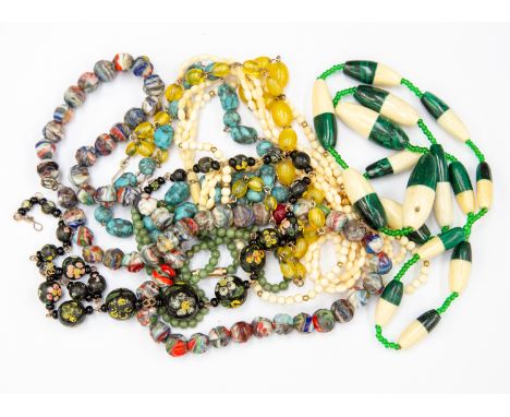 A malachite and ivory necklace, two ivory necklaces, vintage glass necklace, painted wooden bead necklace with gilt wire, cit