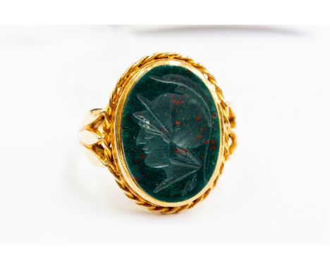 A blood stone intaglio ring, depicting Roman figure, 9ct gold, size N, total gross weight 5.4gms.