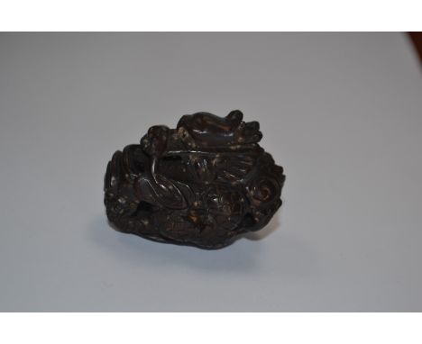 A treen netsuke of a dragon, signed 