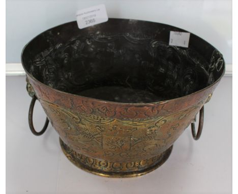 An 18th Century style circular copper jardiniere, the sides chased with figural within landscape with windmill, the other sid