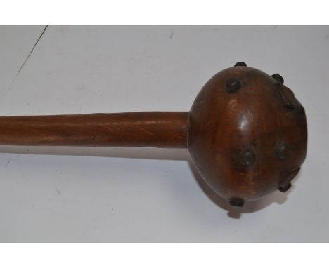 South /East African Knobkerrie club. 68cm long. Fitted with boot hob nails and cleats to ball of the club. 