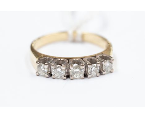An 18ct gold ring, set with five diamonds weighing approx half a ct, size P