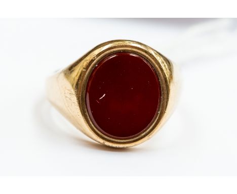 A carnelian set 9ct gold dress ring, size R½, total gross weight 9.7gms.