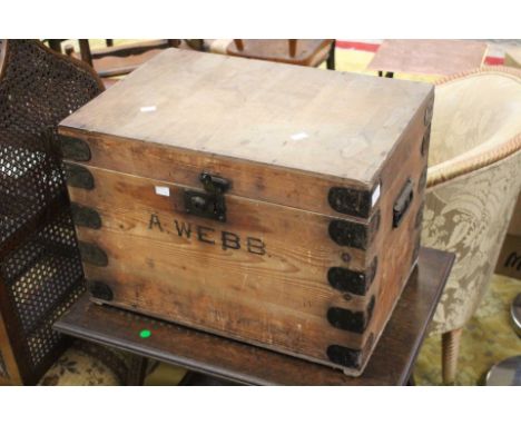 A large metal bound wooden rectangular trunk/box 