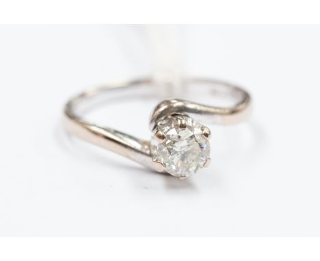 A diamond solitaire 18ct white gold ring, cross-over shoulders, the round brilliant-cut diamond approx 0.50ct, assessed colou