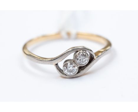 A 9ct gold and diamond two-stone ring, twist setting, size N½, gross weight approx 2.1gms