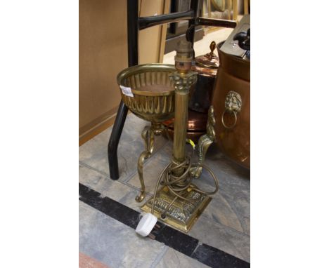 A brass lamp, of corinthian design with a raised brass jardinerre on tripod legs