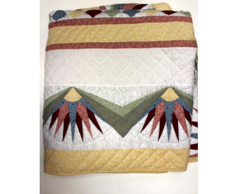 A kingsize quilt made by the ladies of the Amish Community, made in a mariners compass design, Pennsylvania USA, this is not 